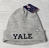 Full view of grey Champion Yale beanie with tags