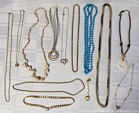 Full group of all necklaces laid out to show quantity, styles and pendants