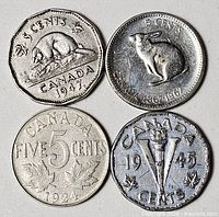 Four Canadian 5 cent coins arranged together showing obverse designs and dates