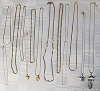 All necklaces laid out showing variety and pendants