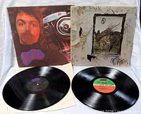 Both LPs displayed with records outside jackets