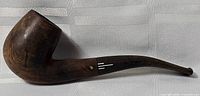 Full left-side view of wooden pipe showing bowl, shank, stem and inlay