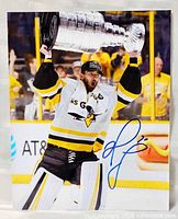 Front view of autographed 8x10 photo showing player with Stanley Cup