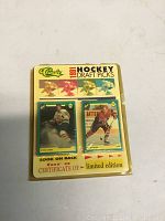 Front of sealed pack showing four card previews and text about certificate of limited edition