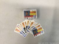 Two 1991 OPeeChee Premier MLB trading card sets, cards featuring Roberto Alomar in front, multiple cards laid out spread in a semi-circle