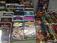 Photo showing several Disney VHS tapes including Lady and the Tramp, Bambi, Pinocchio, Return of Jafar, Sleeping Beauty, Beauty and the Beast, Muppet Christmas Carol, Pocahontas and others.