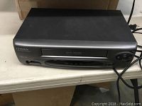 Front view of black Citizen VCR showing power button and tape mechanism