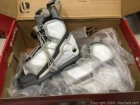 Photo of Liquid Force Alpha wakeboard bindings in original box with plastic protection.