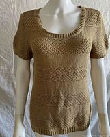 Front view of beige knit short sleeve shirt on mannequin