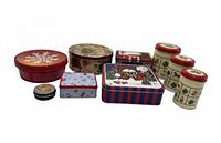 Group shot of all nine Christmas themed tins