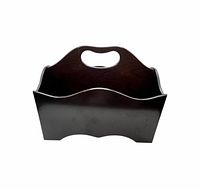 Front view showing curved panels and handle