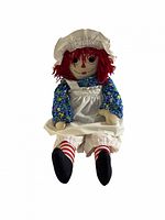 Full view of oversized handmade Raggedy Ann cloth doll with outfit and accessories