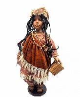 Front view of Laurie porcelain doll showing clothing, necklace, basket and stand