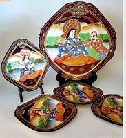 Full view of all five plates arranged to show size difference and decoration