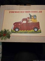 Box front showing product image and title Stoneware Red Truck Cookie Jar