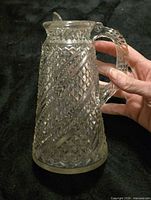 Oblique view showing full pitcher, pattern, handle, spout