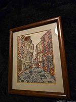 Front view showing full needlepoint image, mat, and wood frame