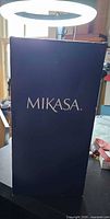Front of dark blue Mikasa box