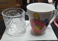 Both mugs side by side for size and style comparison