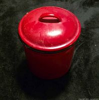 Canister with lid on, showing overall form and color