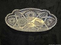 Top view of oval cut glass celery bowl showing hobstar and diamond pattern
