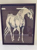 Full view of framed needlepoint horse artwork