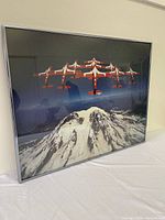 Framed photograph angled view showing Snowbirds formation over mountain