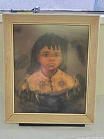Framed pastel portrait on velvet depicting young girl
