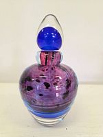 Full front view of art glass perfume bottle