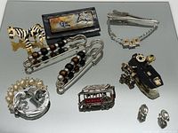 Group shot of all jewelry items on reflective surface