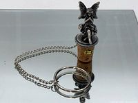 Full view of pewter fairy wine stopper showing chain and ring