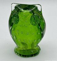 Front view showing owl shape, facial details, controlled bubbles