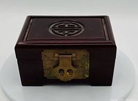 Front view showing brass lock and overall form