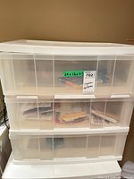 Front view of the three translucent drawers showing contents