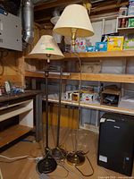 All three floor lamps grouped, showing finishes, bases, and shades