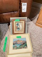 Two framed needlepoint pieces showing sizes and frame types