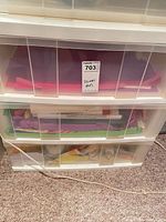 Front view of 3-drawer organizer with visible craft materials inside drawers