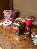 Group shot showing heart box, nesting round box, dip chiller box, tins and wire stand