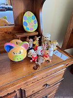 overall group showing piggy bank and array of small English figurines