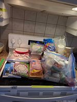 Entire assortment of disposable tableware on stove top