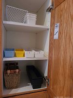 cabinet view showing multiple trays, baskets