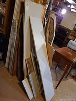 Assorted boards, boxed laminate flooring visible