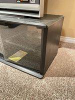 Front view showing Sony logo, sliding glass doors and wear