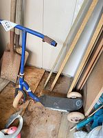 full view of scooter leaning against wall