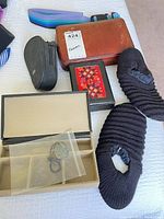 All items group shot including shaver cases, grooming case, slippers, pendant box