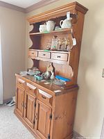 Front view of complete two-piece wooden buffet and hutch