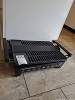 Top view showing entire CounterCraft electric grill with grill plate and handles