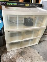 Front view of CSC 3-drawer translucent storage unit with contents visible