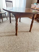 Table shown with both leaves raised, turned legs visible