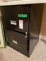 Front and side view of black 2-drawer file cabinet under countertop